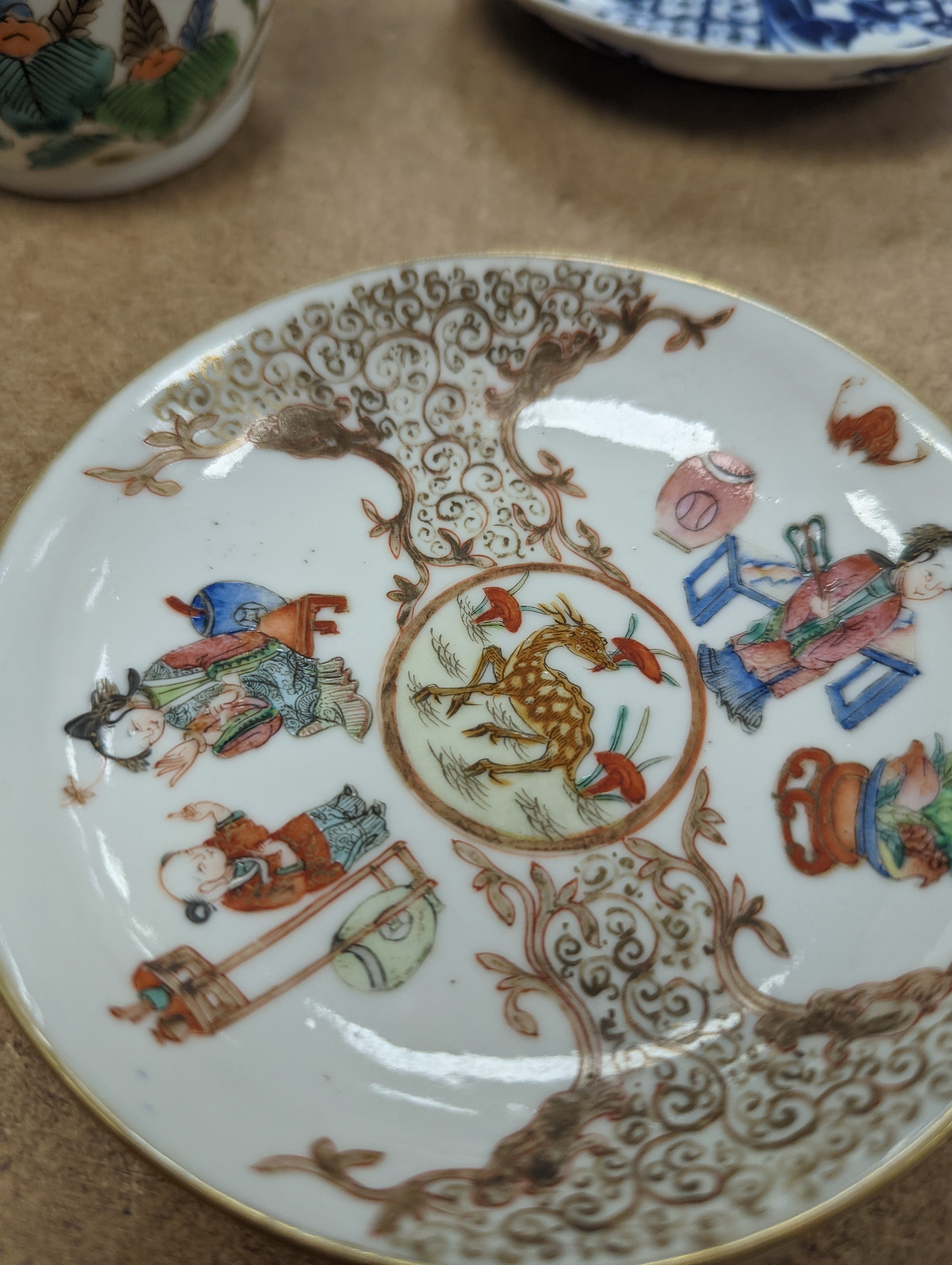 Two Chinese porcelain saucers, and a Chinese enamelled porcelain vase, 12.5cm., 18th century and later